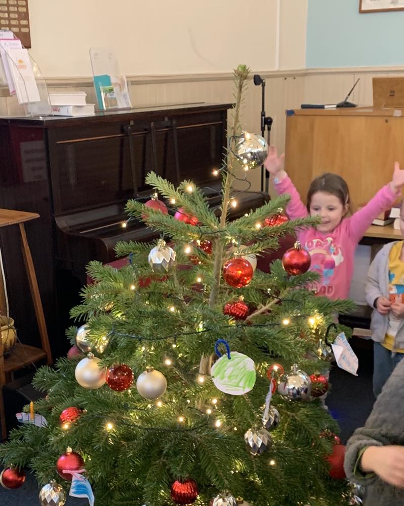 Children Decorate Christmas Tree at Local Church